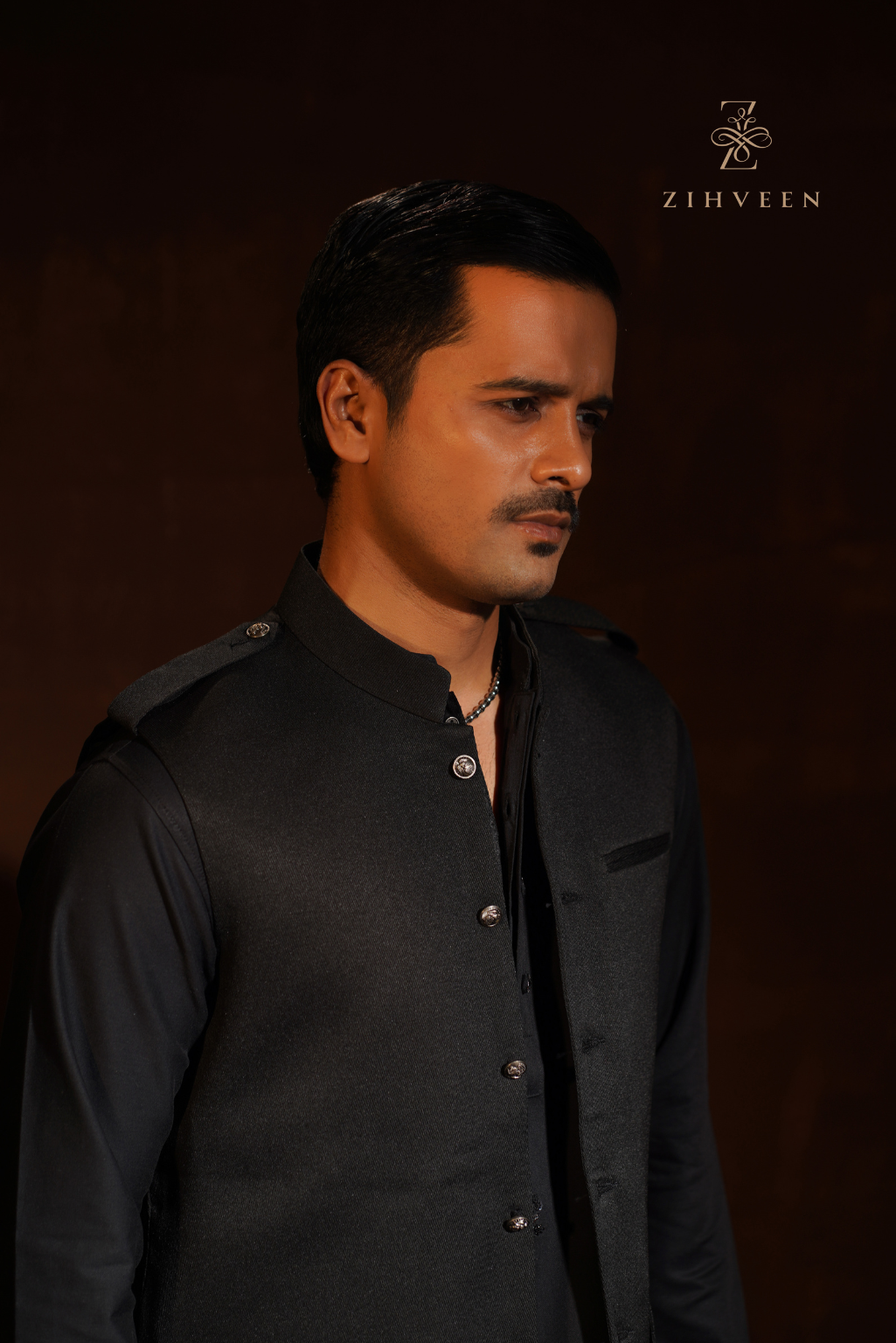 Black vest with shoulder loop and elegant button - view 1